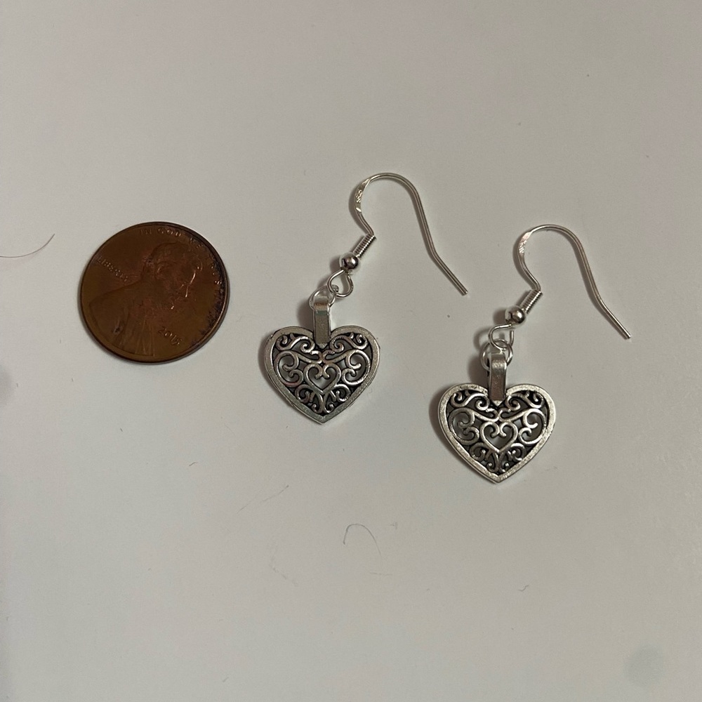 New Handcrafted heart earrings with sterling ear wire.